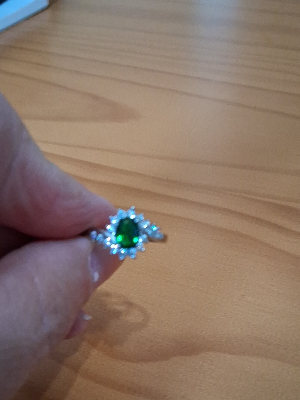 Silver Ring with Green Oval Gem and Halo Accent